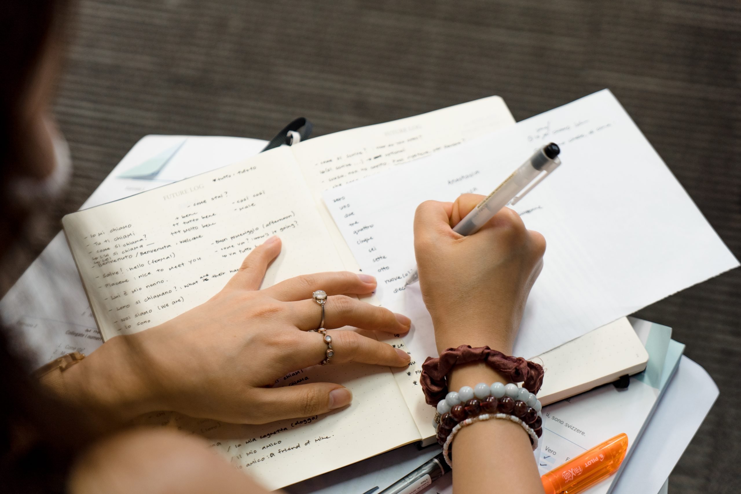 Language student taking notes